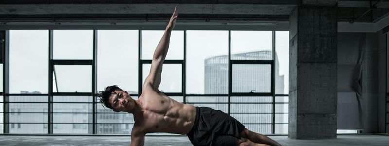 Man in a plank position showing core stability.