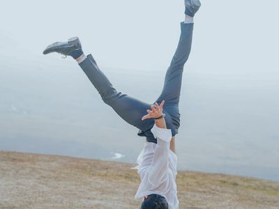Man performing a controlled bodyweight squat.